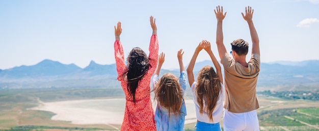 Happy family on vacation in the mountains