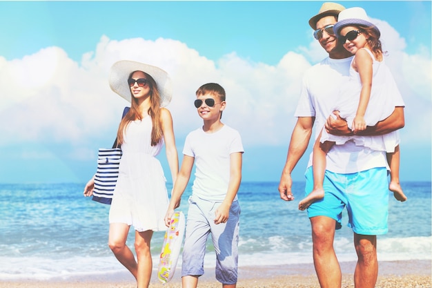 Happy family on vacations on beach