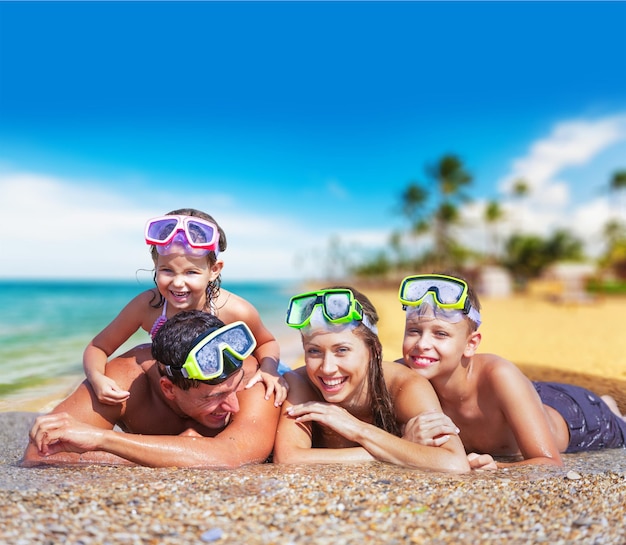 Happy family on vacations on tropical beach