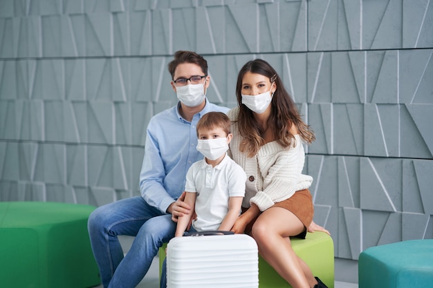 happy family waiting in hotel lobby