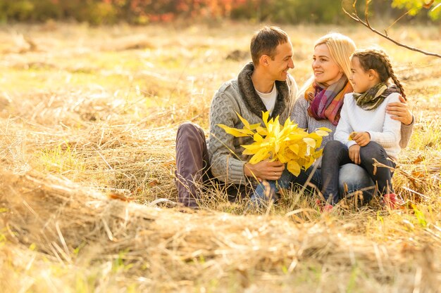 happy family Walking through autumn park