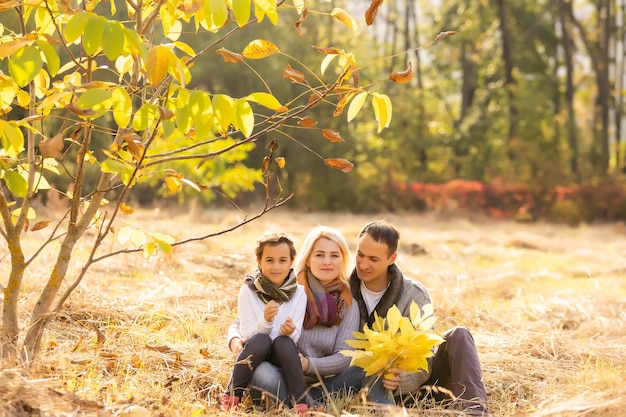 happy family Walking through autumn park