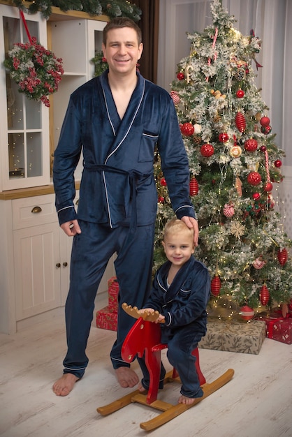 happy family with a child in christmas near the christmas tree