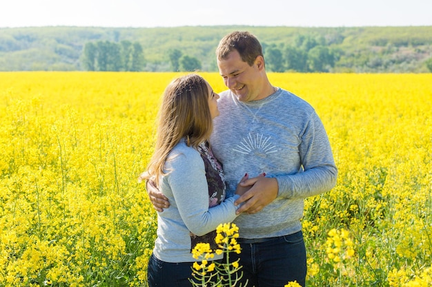 Happy family with the child in the field