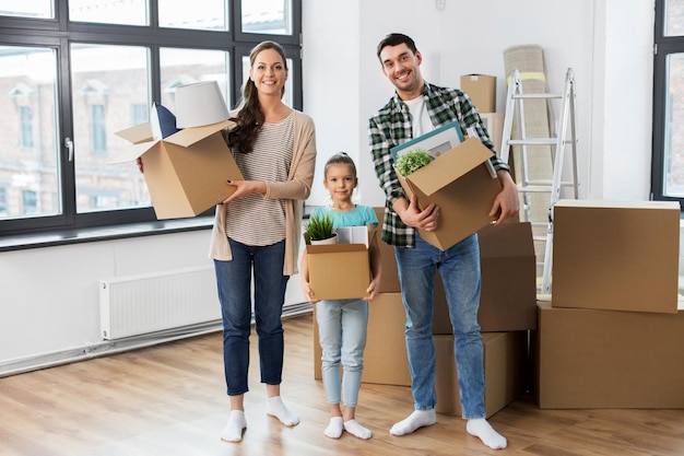 happy family with child moving to new home