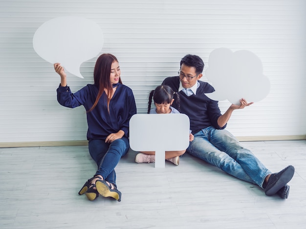 Happy family with father mother and child in home