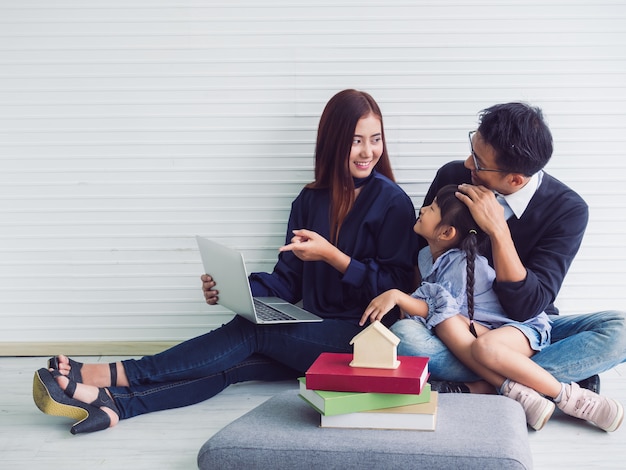 Happy family with father mother and child in home