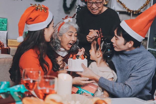 happy family with gifts celebrating christmas together