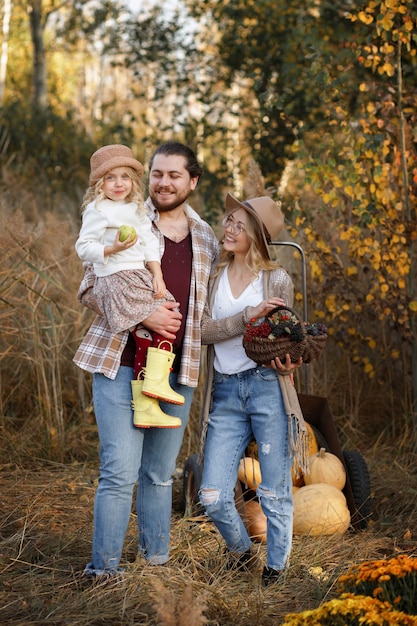 happy family with harvest in autumn