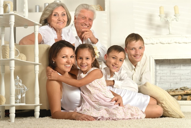 Happy family with kids on couch in living room