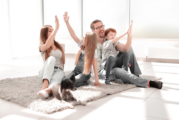 Happy family with kids giving each other a high five