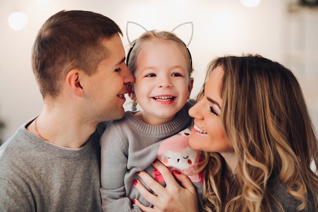 Happy family with a little daughter. Christmas