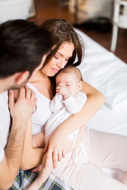 Happy family with newborn baby