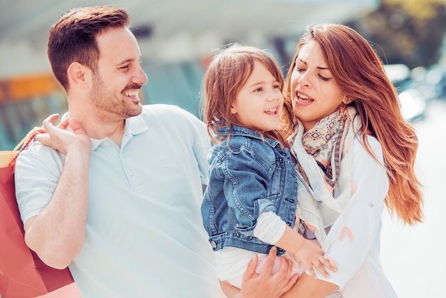 Happy family with shopping bags