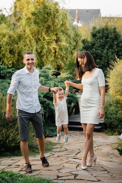 Happy family with their son walking in the Park at sunset. Happiness. Love