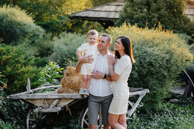 Happy family with their son walking in the Park at sunset. Happiness. Love