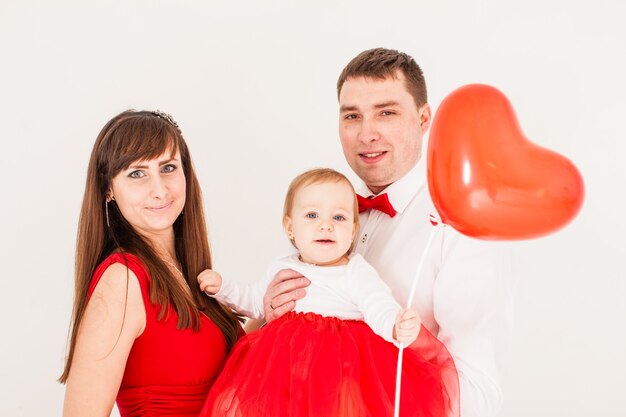 Happy family with toddler baby selebrate The Valentine day