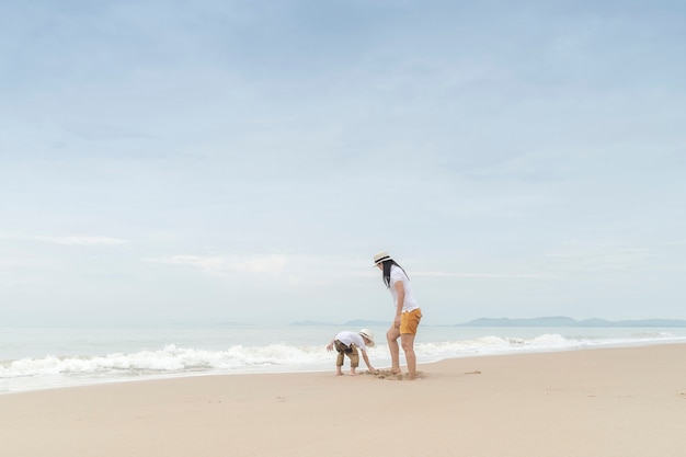 happy family with two kids on the beach,