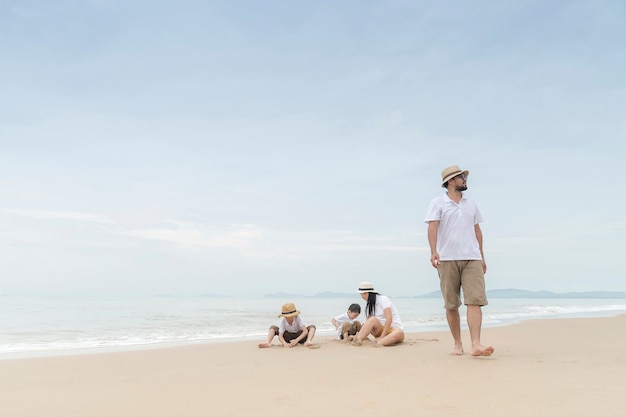 happy family with two kids on the beach,