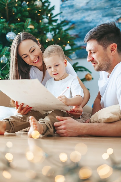 Happy family writing a letter to Santa