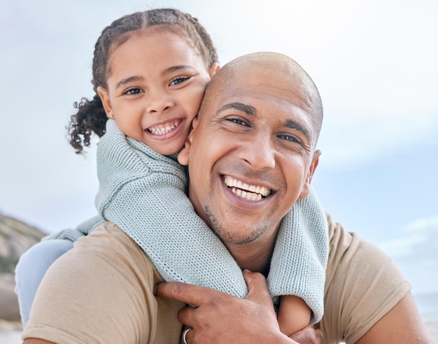 Happy father and child hug with smile for family quality bonding time together in the outdoors Portrait of dad and kid piggyback smiling in joyful happiness for carefree summer vacation in nature