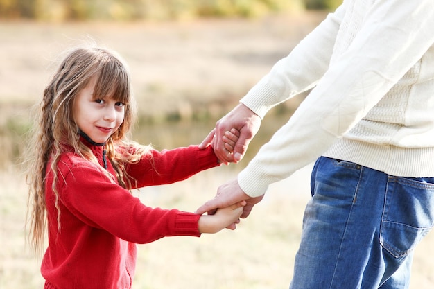 happy father holding child's hand concept family support relations