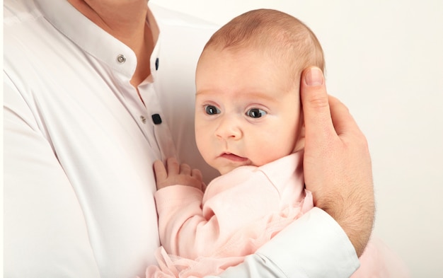 Happy father holding her baby girl