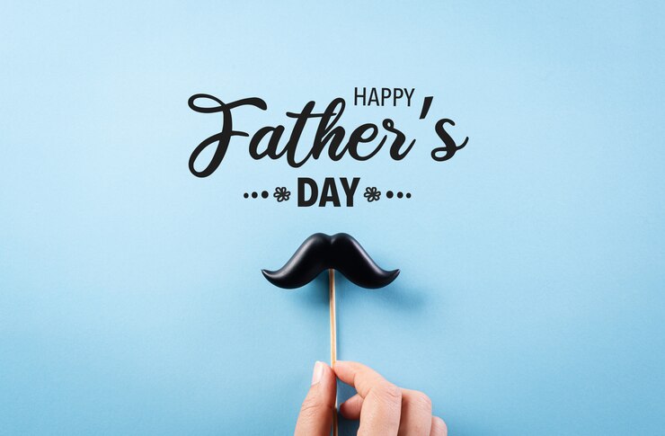 Happy Father's Day concept on bright blue paper