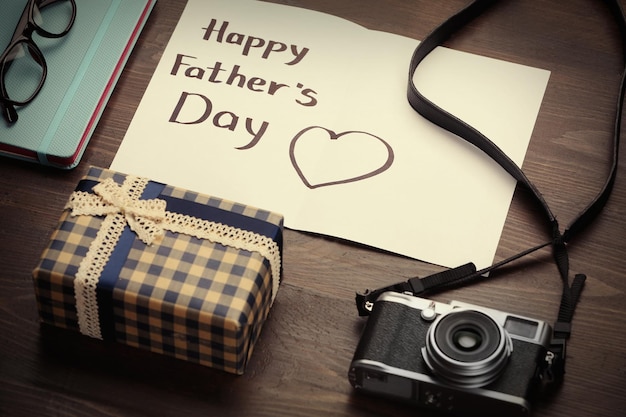 Photo happy father's day set of things on wooden background