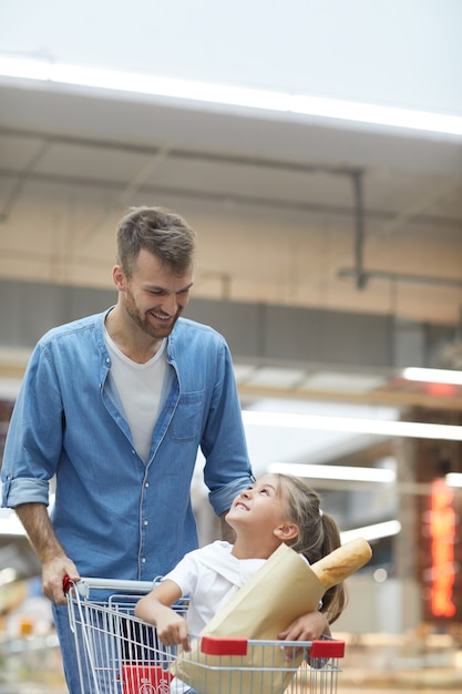 Happy Father Shopping in Supermarket