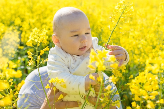 Happy father with the child in the field