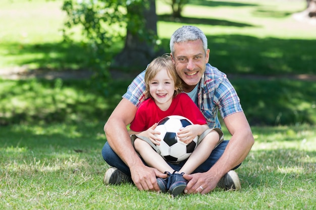 Happy father with his son at the park 