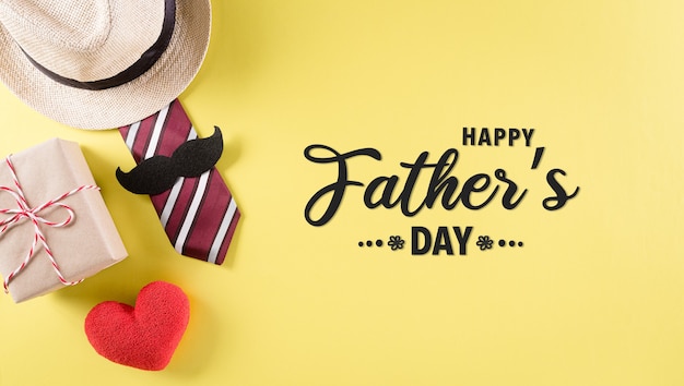 Happy Fathers Day background concept with tie and  mustache hat gift box red heart  with the text on pastel yellow background