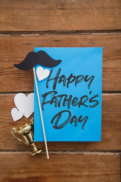 Photo happy fathers day card with paper mustache and love hearts