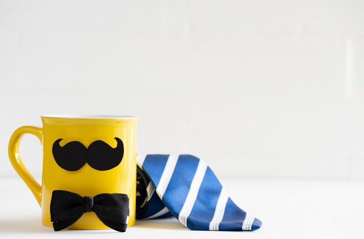 Happy fathers day concept. blue tie with mustache and bow tie