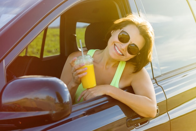 Happy female driver smiling