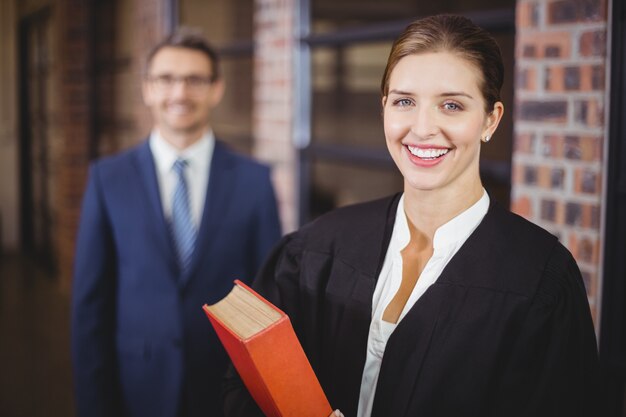 Happy female lawyer with businessman