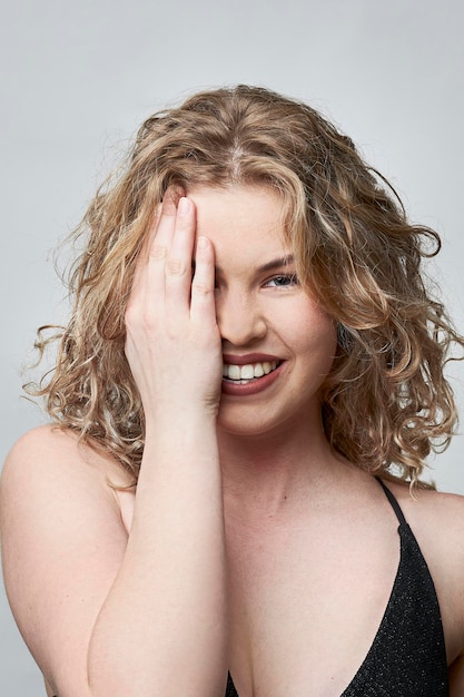 Happy female posing with hand