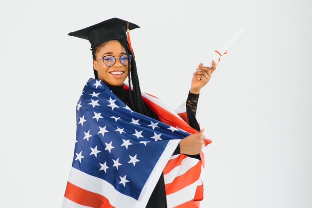 Happy female student with USA flag background. Studying in USA conceptual