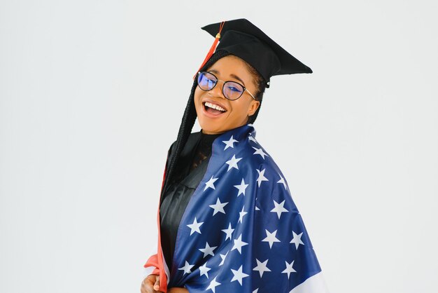 Happy female student with USA flag wall. Studying in USA conceptual