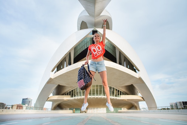 Happy female tourist in the City of Arts and Sciences in Valencia