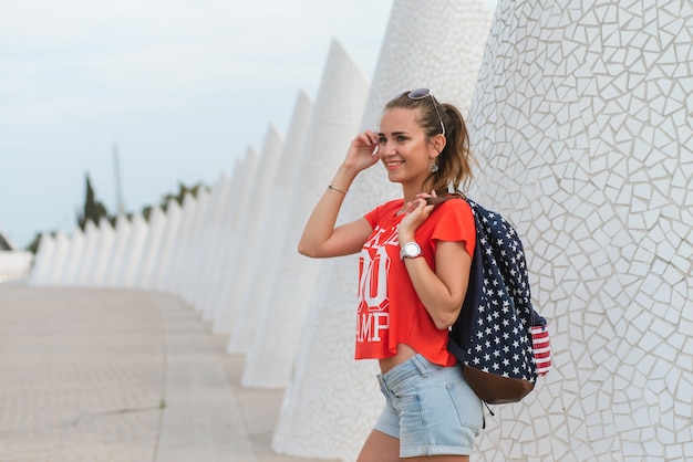 Happy female tourist in the City of Arts and Sciences in Valencia