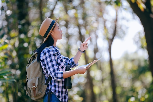 Happy female tourist to travel in wild trip hiking during vacation. Travel concept