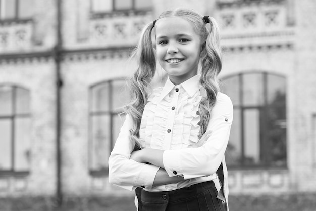 Happy first day at school little girl on september 1 small
child back to learn on september 1 knowledge day start of school
september 1 beginning of school year startup back in september
1