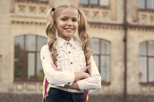 Happy first day at school little girl on september 1 small\
child back to learn on september 1 knowledge day start of school\
september 1 beginning of school year startup back in september\
1