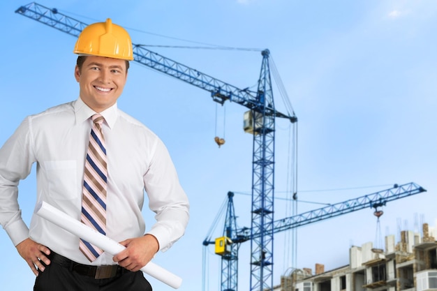 Happy foreman with hard hat  on background