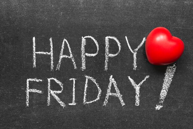 Photo happy friday exclamation handwritten on chalkboard with red heart symbol