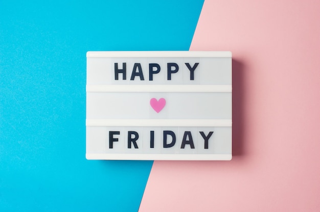 Photo happy friday text on display lightbox on blue and pink background