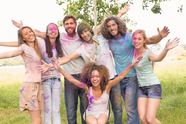 Happy friends covered in powder paint