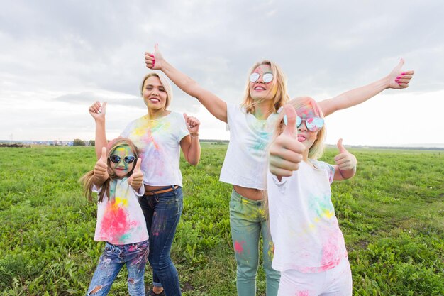 Happy friends enjoying on field against sky